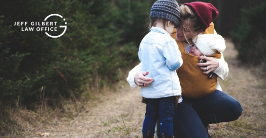 mother embracing her children