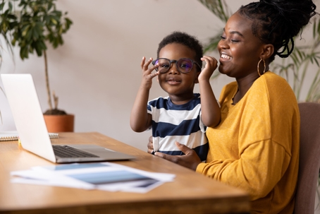mother and son looking at a laptop